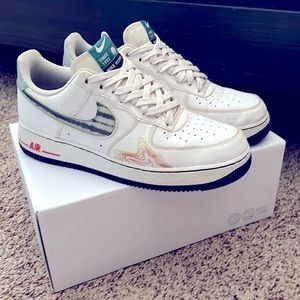 White Air Force ones, with green red yellow and purple designs